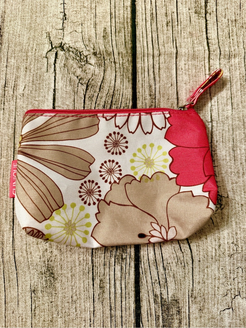 Clinique cosmetic bag with floral print. Zippered